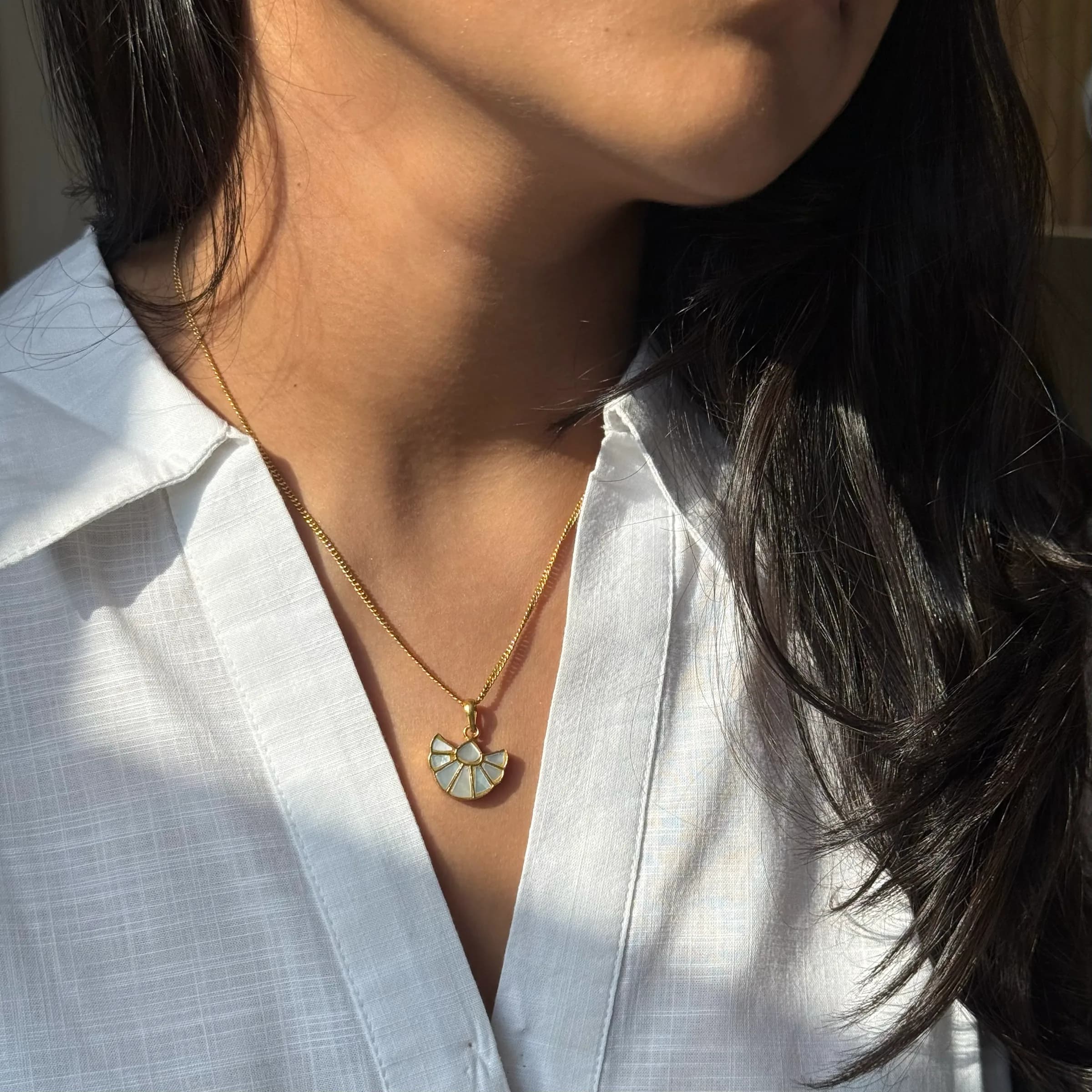 Pākhi Pendant – Mother-of-Pearl – worn close-up